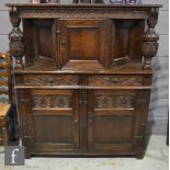 Amended description - A small carved oak court cupboard in the 17th Century style,