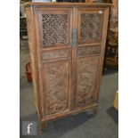 AMENDED DESCRIPTION A pair of south east Asian carved hardwood food cabinets, the two door