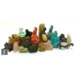 A collection of Chinese and Tibetan hardstone carvings and seals, including rose quartz Buddhas,