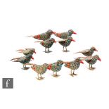 A collection of mid 20th Century Nepalese bird figures, each of the standing fillagree birds applied