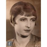 A Reprograph Studio, London monochrome photograph of the actress Louise Brooks late 1920s, framed,