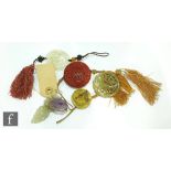 A collection of 20th Century Chinese amulet and talisman to include five green hardstone examples, a