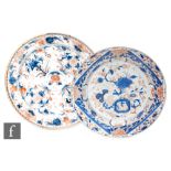 Two 18th Century Chinese Imari wall chargers, each of circular form enamelled in iron red and