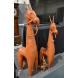 A collection of Peruvian pottery llama figures, the stylised figures each modelled in standing
