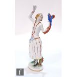 A 1930s Austrian Augarten figure designed by Ida Schwetz-Lehmann of a young lady with a parrot