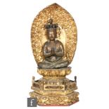 An 18th to 19th Century Sino-Tibetan gilt copper alloy figure of Vajradhara, the Adibuddha seated in