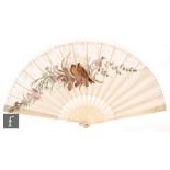 A 19th Century carved ivory silk and lace edged fan, the central scene painted with a robin amidst