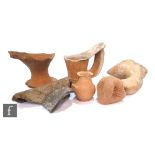 A Roman amphora handle and neck, another amphora neck and various ancient pottery sherds and