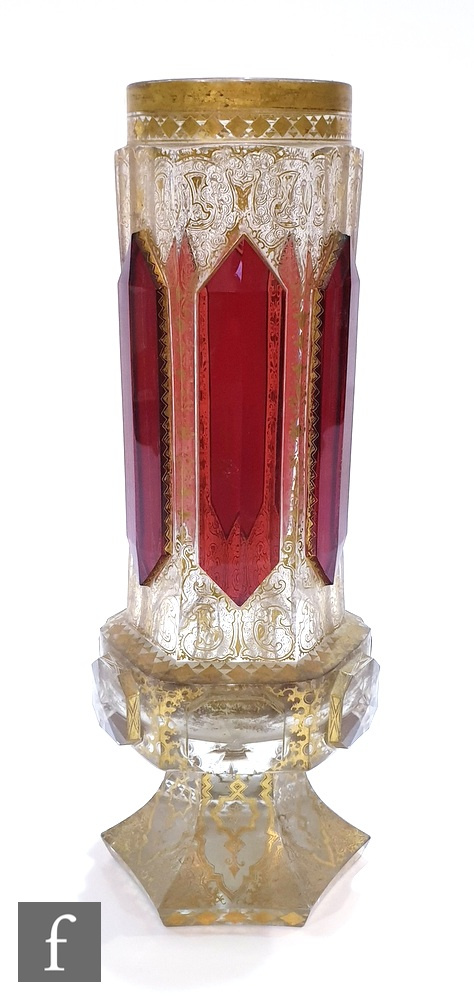 A 19th Century Bohemian vase of hexagonal form with applied ruby panels over a heavily gilded ground
