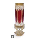 A 19th Century Bohemian vase of hexagonal form with applied ruby panels over a heavily gilded ground