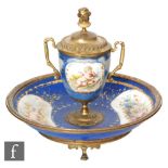A late 19th Century Sevres style inkwell of urn form with metal mounts with female bust finial and