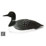 A large carved cedar wood figure of a Great Northern Diver by Mike Lythgoe, with speckled and