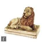 An early 19th Century Wood and Caldwell pearlware model of a recumbent lion glazed in light brown