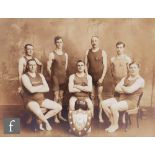 A sepia photograph depicting the Frome Swimming Club first team of 1924 proudly displaying their