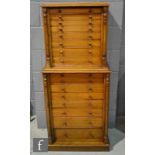 A 19th Century mahogany Wellington style collectors cabinet, the upper section fitted with eight