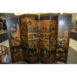 A 20th Century Chinese black lacquered six-fold screen, painted in gilt and polychrome enamels