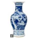 A late 19th to early 20th Century Chinese blue and white 'Prunus' vase of baluster form, the