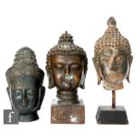 A collection of three cast metal Tibetan/Indian figures of Buddha, each modelled as a shakyamuni