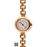 An early 20th Century ladies 15ct wrist watch, Arabic numerals to a white enamelled dial to a