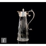 An early 20th Century silver plated and clear glass claret jug, tapering diamond cut clear glass