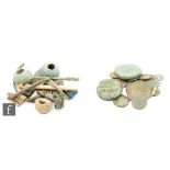 A collection of 3rd and 4th Century Roman bronze coins, glass beads, fibulae and cosmetic tools. (