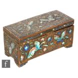 A late 19th to early 20th Century Chinese gilt metal 'Jewelled' lidded box, of rounded form, inset