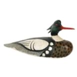 A carved wooden decoy duck by Danny Clewett with painted finish, signed and dated to the base