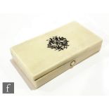 A Victorian rectangular ivory hinged box fitted with a three divisioned interior and monogram to