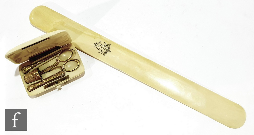 An early 20th Century four piece silver gilt ivory cased etui, Birmingham 1910 and a late 19th