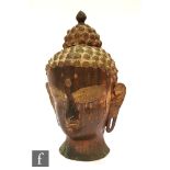 A Sino-Tibetan style cast alloy figure of Shakyamuni Buddha head, the head modelled with downcast