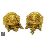 A pair of gilt wall brackets modelled as rams head with acanthus leaves and drapes, height 21cm (2)