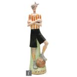 A 1920s German Schafer Vater bisque figure 'The Victor', modelled as a footballer wearing red and