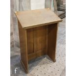 A 20th Century oak lectern stand with lunette frieze over an arch panel and plinth base, height
