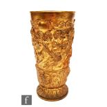 A 19th Century gilt metal presentation beaker heavily relief moulded with a procession of putti