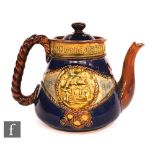 A Royal Doulton commemorative teapot for Lord Nelson 'born 1758, died 1805' with tubelined motto and