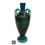 A late 19th Century Bretby vase in the manner of Dr Christopher Dresser of footed slender ovoid form