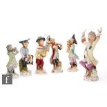 A collection of continental porcelain monkey band figures in the Meissen style, to include