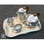 A 1960s Picquot Ware five piece tea set comprising teapot, hot water jug, milk, open twin handled