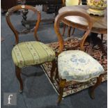 A pair of Victorian carved walnut salon chairs with