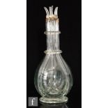 A 19th Century quatrefoil spirit decanter, of footed ovoid form with two ringed neck, with four