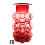 A large post war ruby glass vase with rings of relief moulded bubbles below a collar neck, height
