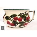 A Wemyss chamber pot decorated with hand painted cherries, impressed mark and painted T. Goode &