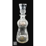 A 20th Century clear cut crystal vase in the form of a thistle with matched stopper, together with a