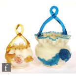 A late 19th Century opaline posy basket with applied blue glass trail, flower and twisted handle,