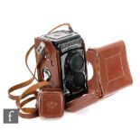 A Rolleiflex Franke & Heidecke 120mm camera No T2126100 in brown leather case.