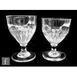 Two glass rummers, circa 1800, both with ovoid petal moulded bowls above capstan stems and