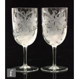 A pair of 19th Century drinking glasses, the ovoid bowls acid etched in the manner of John Northwood