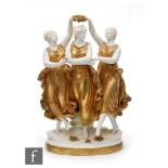An early 20th Century Volkstedt porcelain figure of the 'Three Graces' modelled in dancing position,