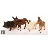 A group of Beswick farm animals comprising Vietnamese Pot-Bellied Pig model G189, designed by Amanda