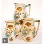 A graduated set of three 19th Century Staffordshire jugs relief moulded with hazelnuts to a bough